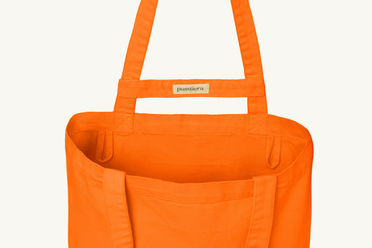 pusstiera tote bag An elegant sustainable cotton canvas tote bag, eco-friendly, premium Swedish design with Scandinavian quality, made in Europe, in limited edition numbered bags. vivid orange color with four utility loops and a stabilizing strap