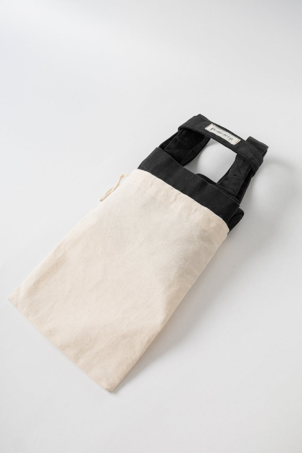 pusstiera tote bag An elegant sustainable cotton canvas tote bag, eco-friendly, premium Swedish design with Scandinavian quality, made in Europe, in limited edition numbered bags. Black caviar color with four utility loops and a stabilizing strap