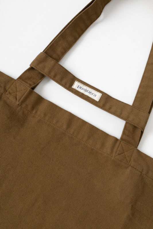pusstiera tote bag An elegant sustainable cotton canvas tote bag, eco-friendly, premium Swedish design with Scandinavian quality, made in Europe, in limited edition numbered bags. Cappuccino color with four utility loops and a stabilizing strap