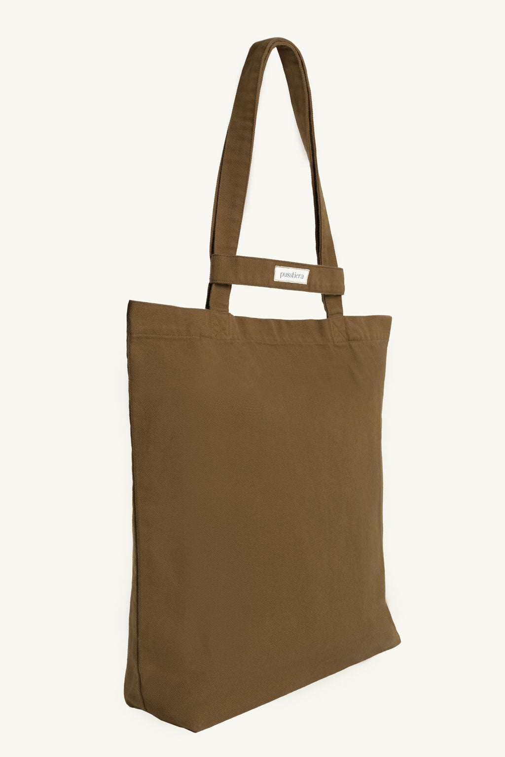 pusstiera tote bag An elegant sustainable cotton canvas tote bag, eco-friendly, premium Swedish design with Scandinavian quality, made in Europe, in limited edition numbered bags. Cappuccino color with four utility loops and a stabilizing strap