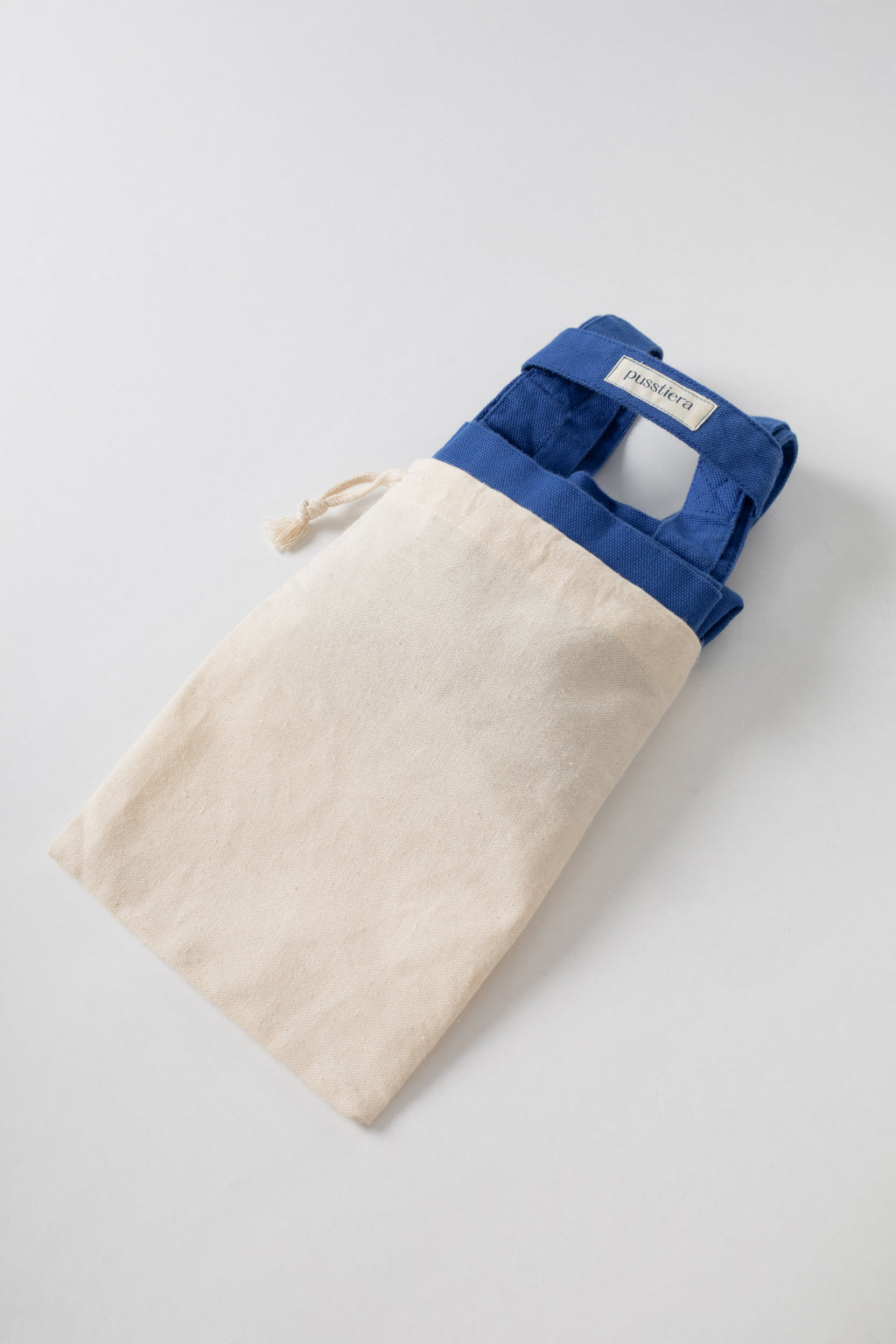 pusstiera tote bag An elegant sustainable cotton canvas tote bag, eco-friendly, premium Swedish design with Scandinavian quality, made in Europe, in limited edition numbered bags. Classic blue color with four utility loops and a stabilizing strap