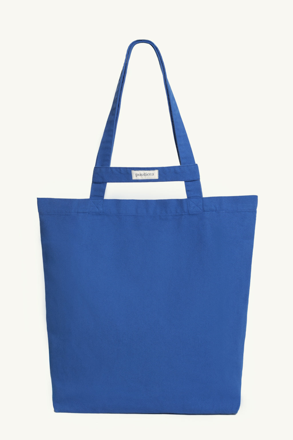 pusstiera tote bag An elegant sustainable cotton canvas tote bag, eco-friendly, premium Swedish design with Scandinavian quality, made in Europe, in limited edition numbered bags. Classic blue color with four utility loops and a stabilizing strap