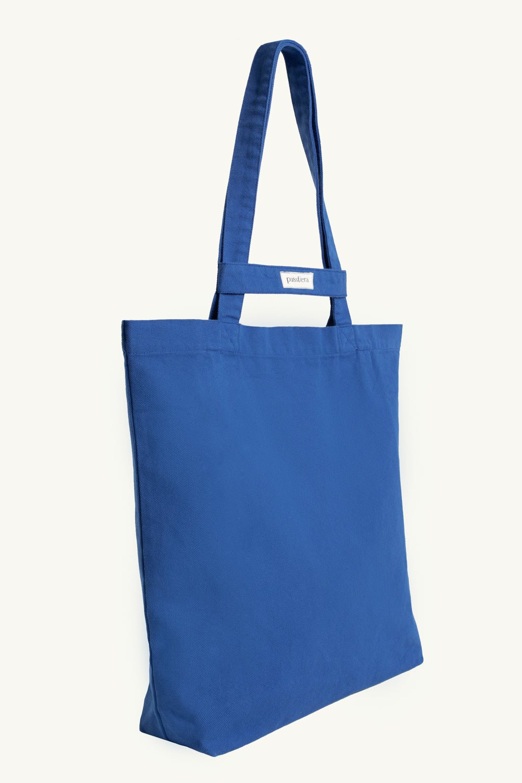 pusstiera tote bag An elegant sustainable cotton canvas tote bag, eco-friendly, premium Swedish design with Scandinavian quality, made in Europe, in limited edition numbered bags. Classic blue color with four utility loops and a stabilizing strap