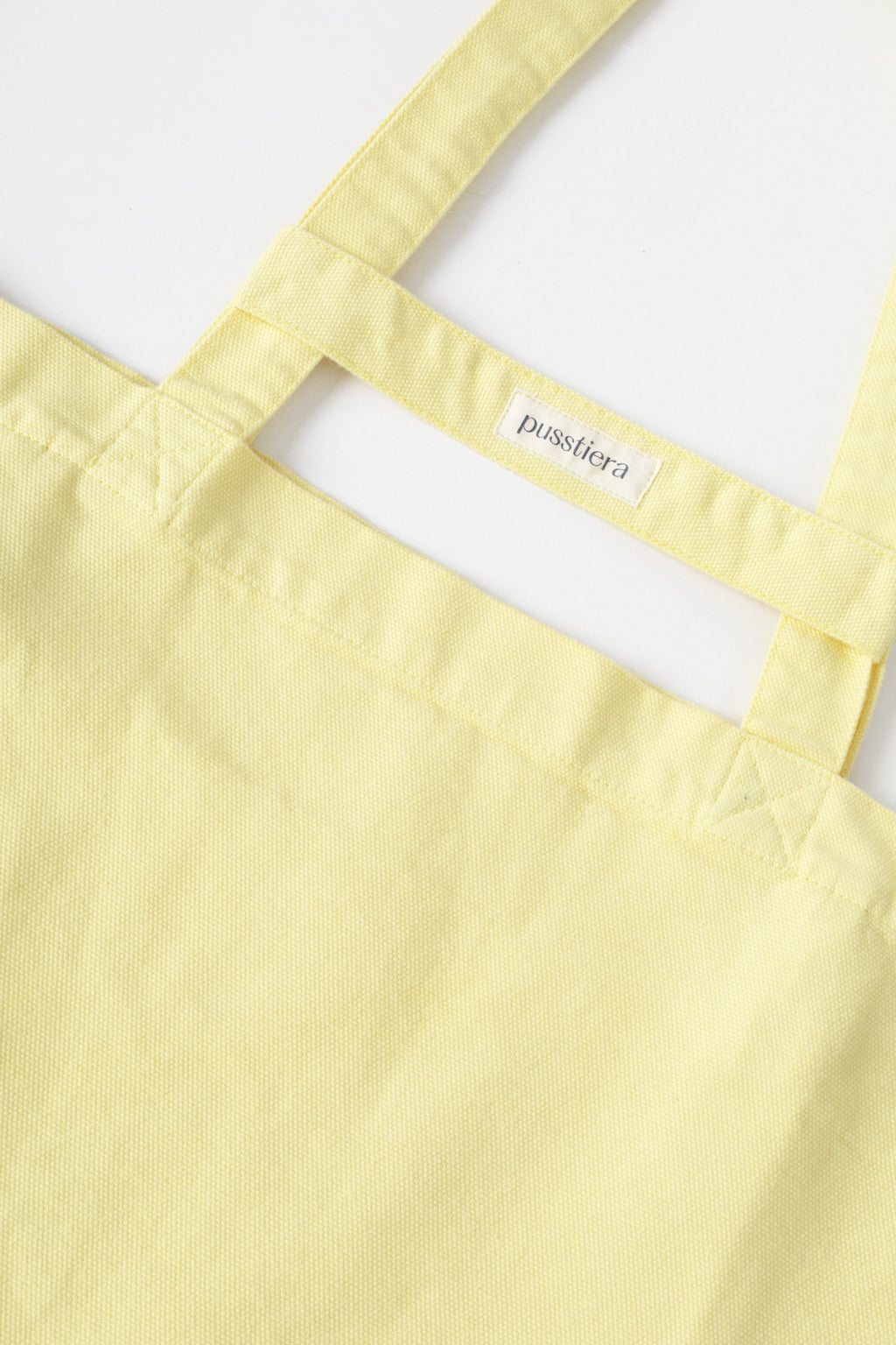 pusstiera tote bag An elegant sustainable cotton canvas tote bag, eco-friendly, premium Swedish design with Scandinavian quality, made in Europe, in limited edition numbered bags. custard lemon color
