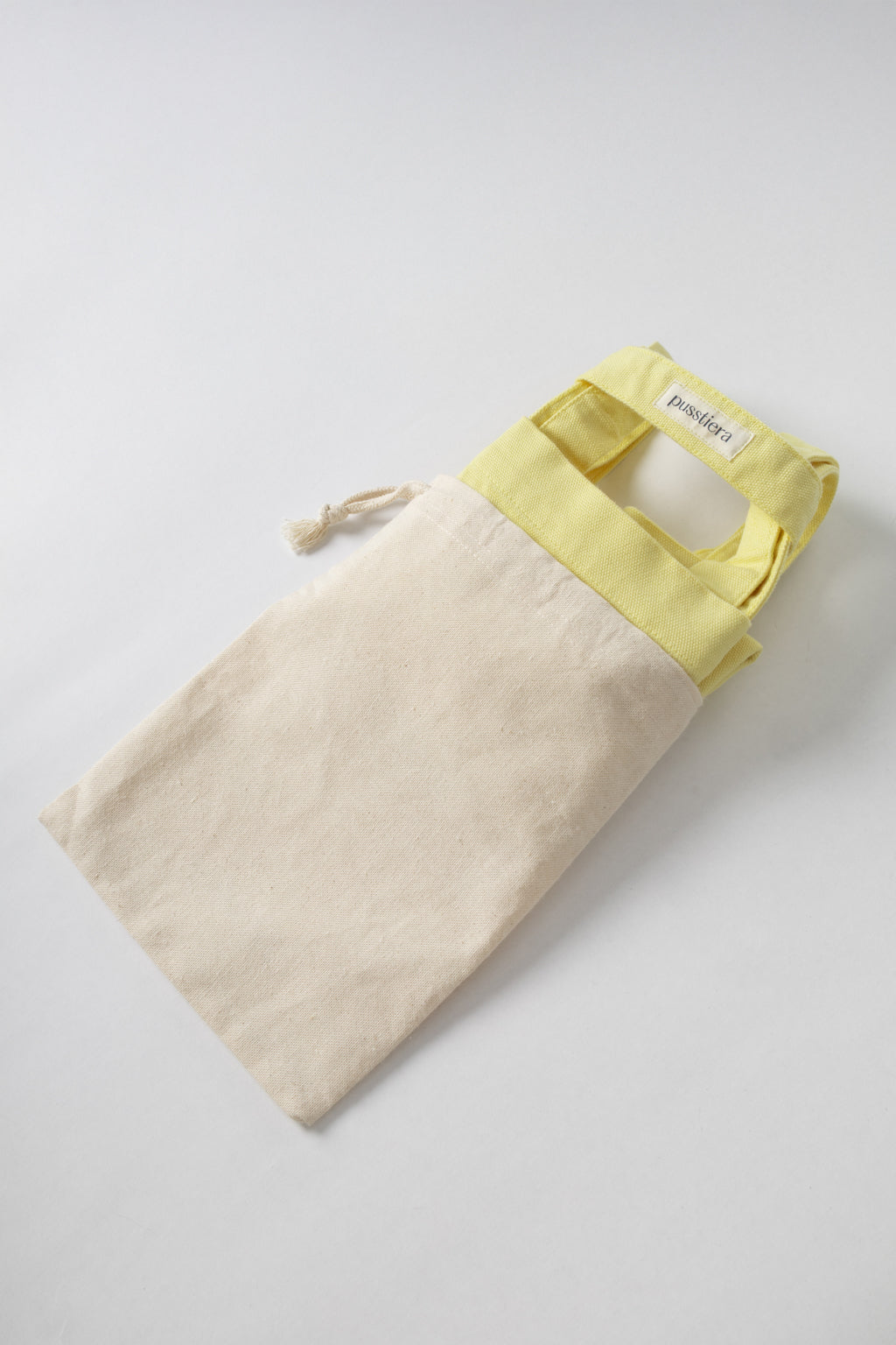 pusstiera tote bag An elegant sustainable cotton canvas tote bag, eco-friendly, premium Swedish design with Scandinavian quality, made in Europe, in limited edition numbered bags. custard lemon color