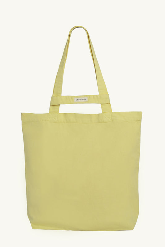 pusstiera tote bag An elegant sustainable cotton canvas tote bag, eco-friendly, premium Swedish design with Scandinavian quality, made in Europe, in limited edition numbered bags. custard lemon color with four utility loops and a stabilizing strap