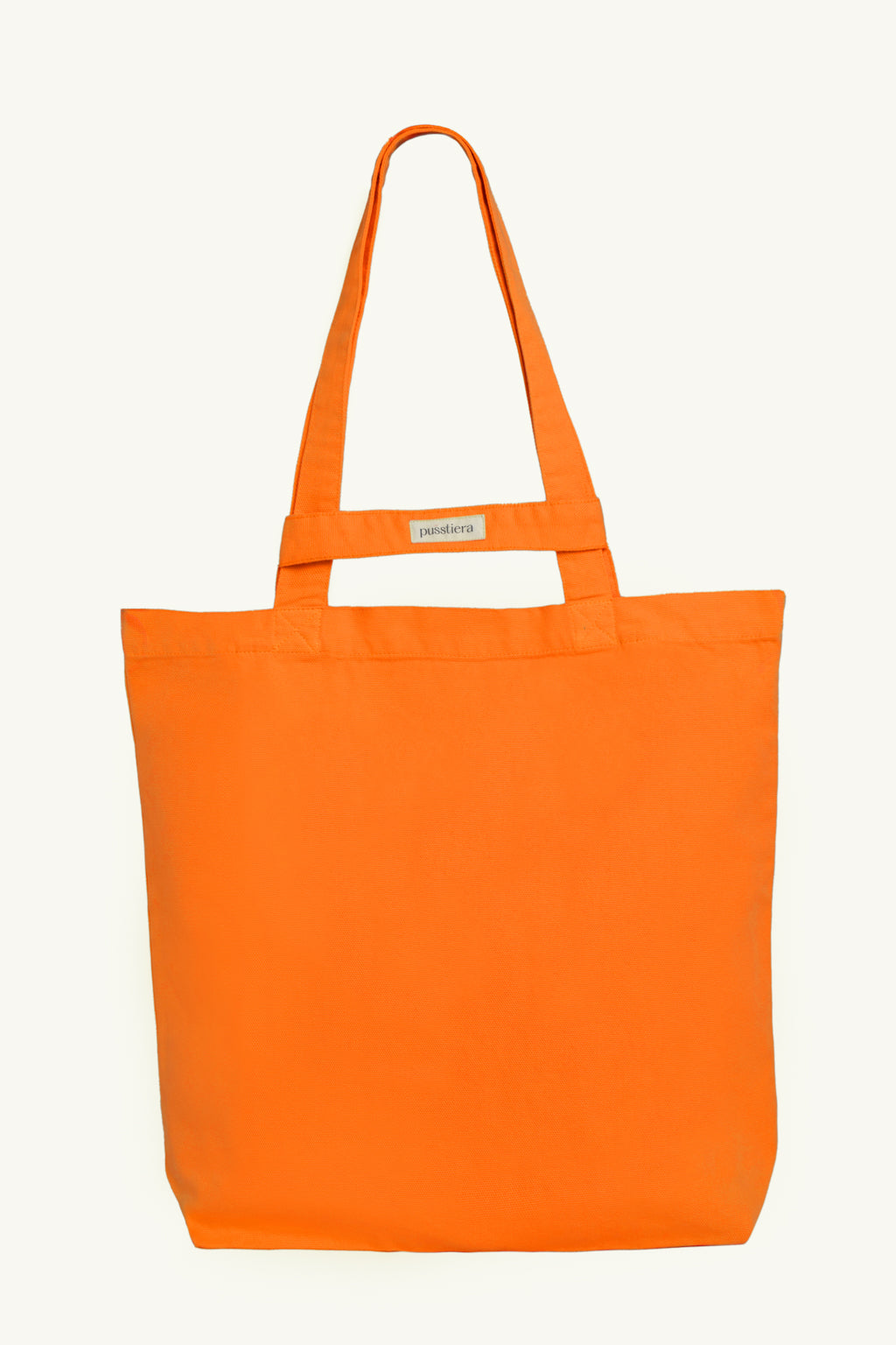 pusstiera tote bag An elegant sustainable cotton canvas tote bag, eco-friendly, premium Swedish design with Scandinavian quality, made in Europe, in limited edition numbered bags. vivid orange color with four utility loops and a stabilizing strap