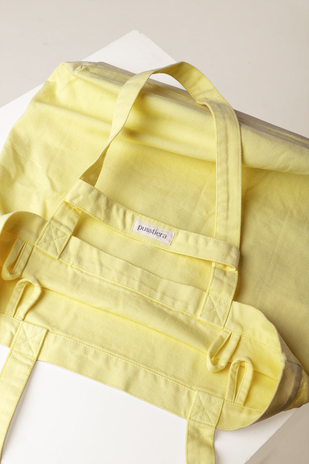 heavy cotton tote bag pusstiera color custard featuring four loops